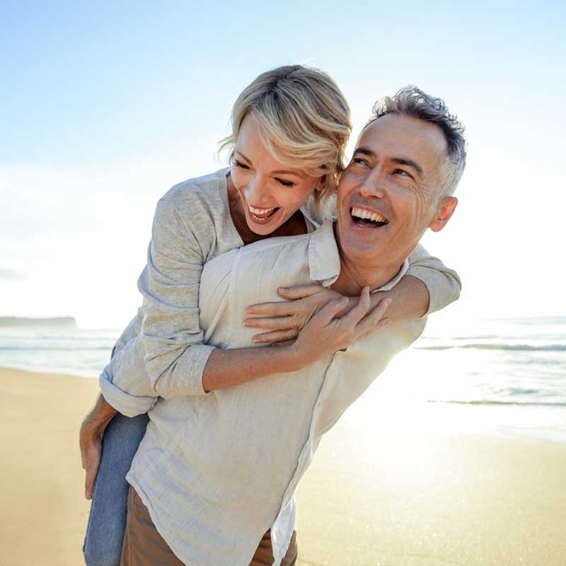 Happy couple enjoying life with hearing aids